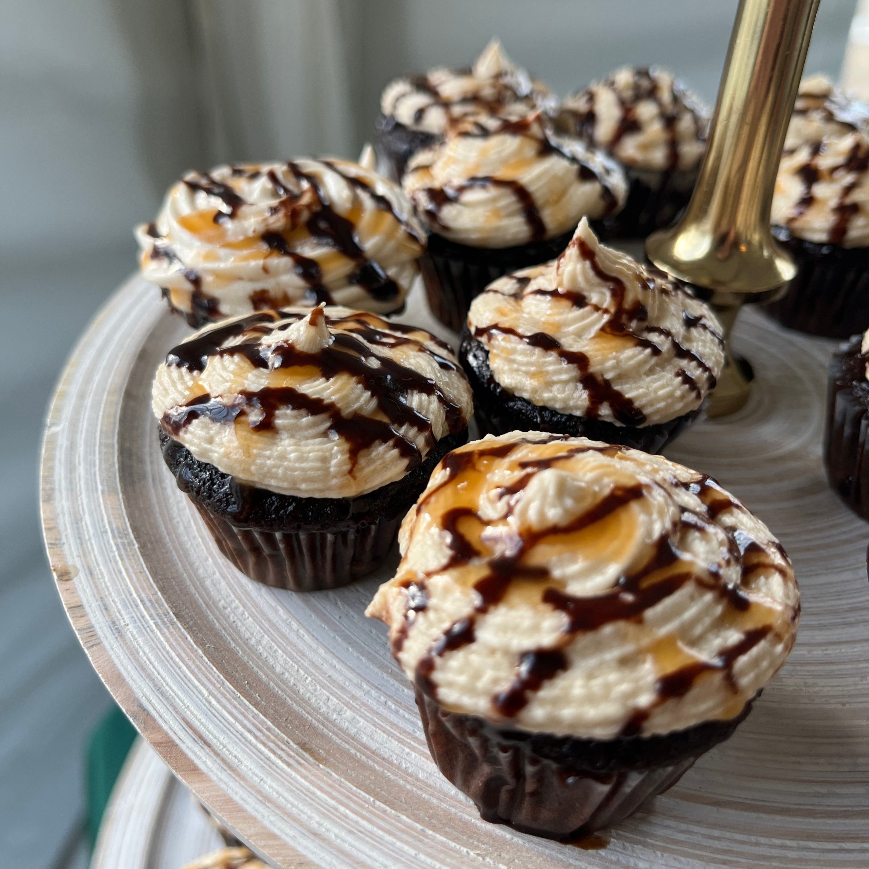 Mini chocolate cupcakes on a decorative tray